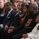 George Floyd’s brother Philonise Floyd (2nd from Right) and George Floyd’s daughter Gianna Floyd (Right) watch as President Joe Biden signs a historic Executive Order to advance effective, accountable policing and strengthen public safety during an event held in the East Room of The White House in Washington, DC on May 25, 2022.